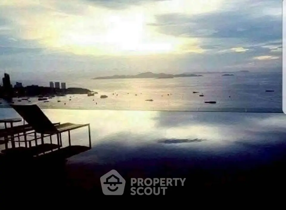 Stunning infinity pool with breathtaking ocean view at sunset, perfect for luxury living.
