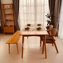 Stylish dining area with wooden table and chairs, perfect for modern living.