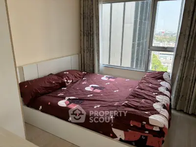 Cozy bedroom with city view and stylish decor in modern apartment