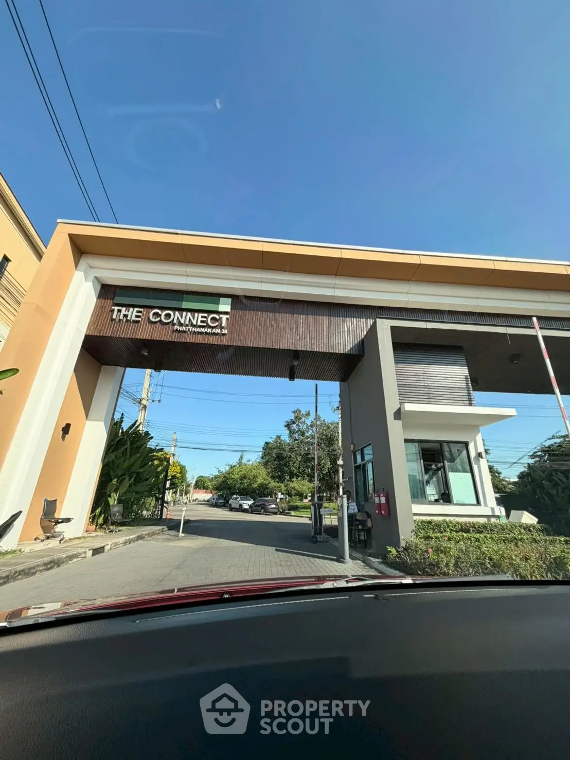 Modern entrance gate of residential community with clear blue sky