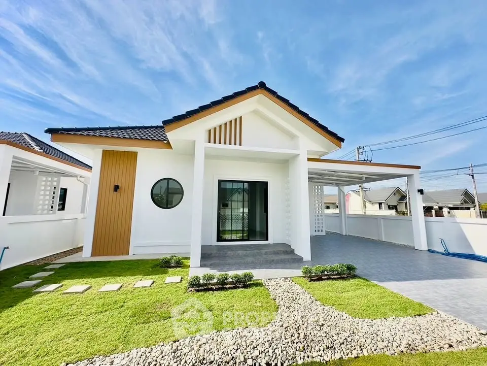 Charming modern house with a sleek design and spacious driveway in a serene neighborhood.