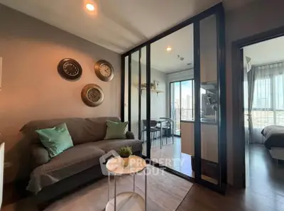 Modern living room with glass partition and cozy decor in urban apartment