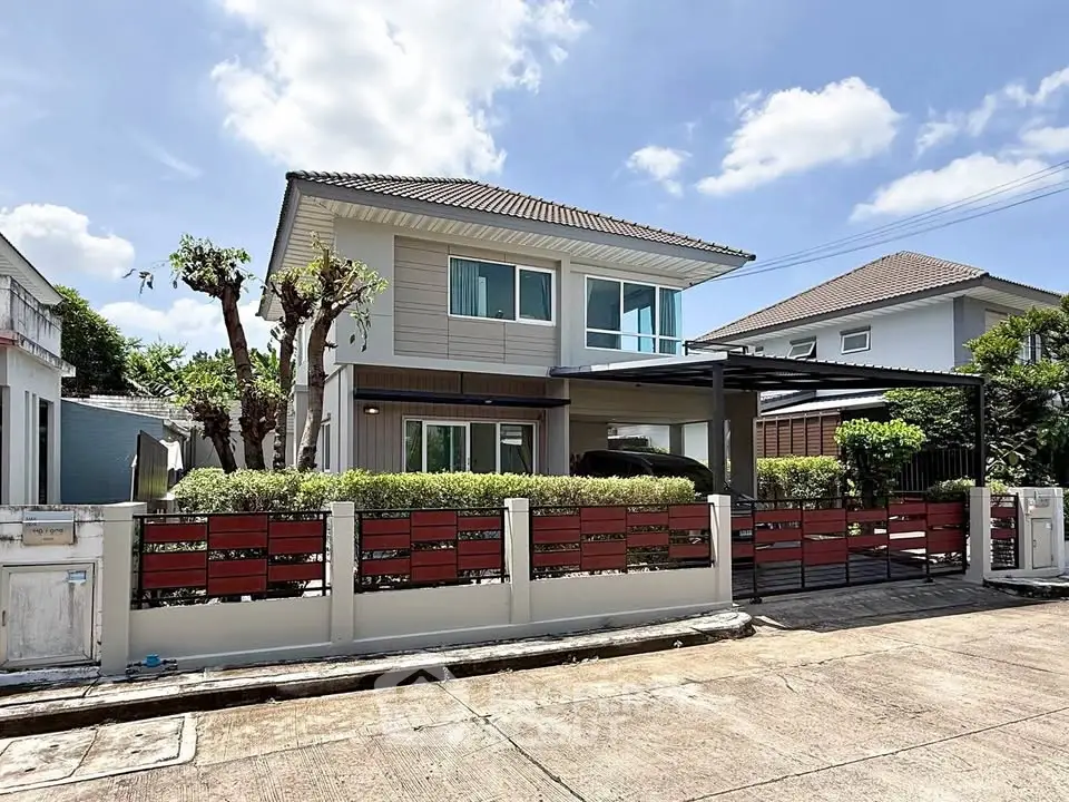 Charming two-story house with modern design and spacious driveway in a serene neighborhood.