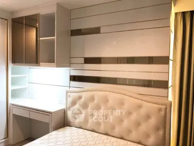 Luxurious bedroom with elegant headboard and built-in storage solutions