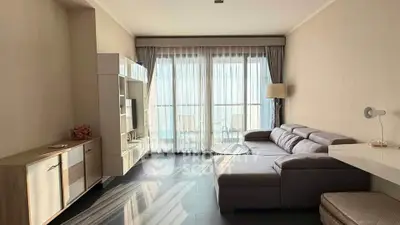 Spacious modern living room with large windows and stylish furniture