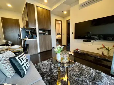 Modern living room with stylish decor and open kitchen layout in a contemporary apartment.