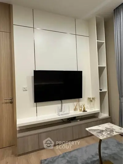 Modern living room with sleek TV setup and stylish decor