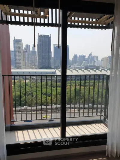 Stunning cityscape view from a modern apartment balcony with sleek railing design.