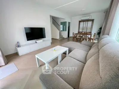 Spacious living room with modern decor and large sectional sofa