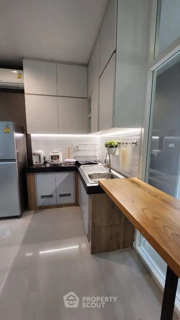 Modern kitchen with sleek cabinets and stainless steel appliances