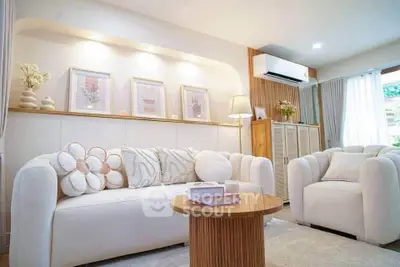 Elegant living room with cozy white sofas and stylish decor