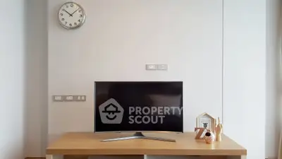 Modern living room with sleek TV setup and minimalist decor