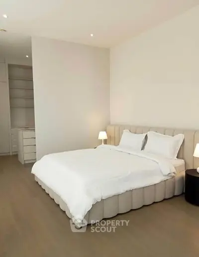 Spacious modern bedroom with elegant decor and cozy lighting