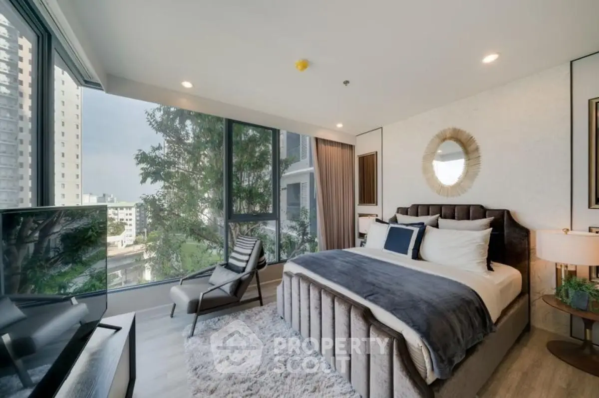 Luxurious bedroom with floor-to-ceiling windows and city view