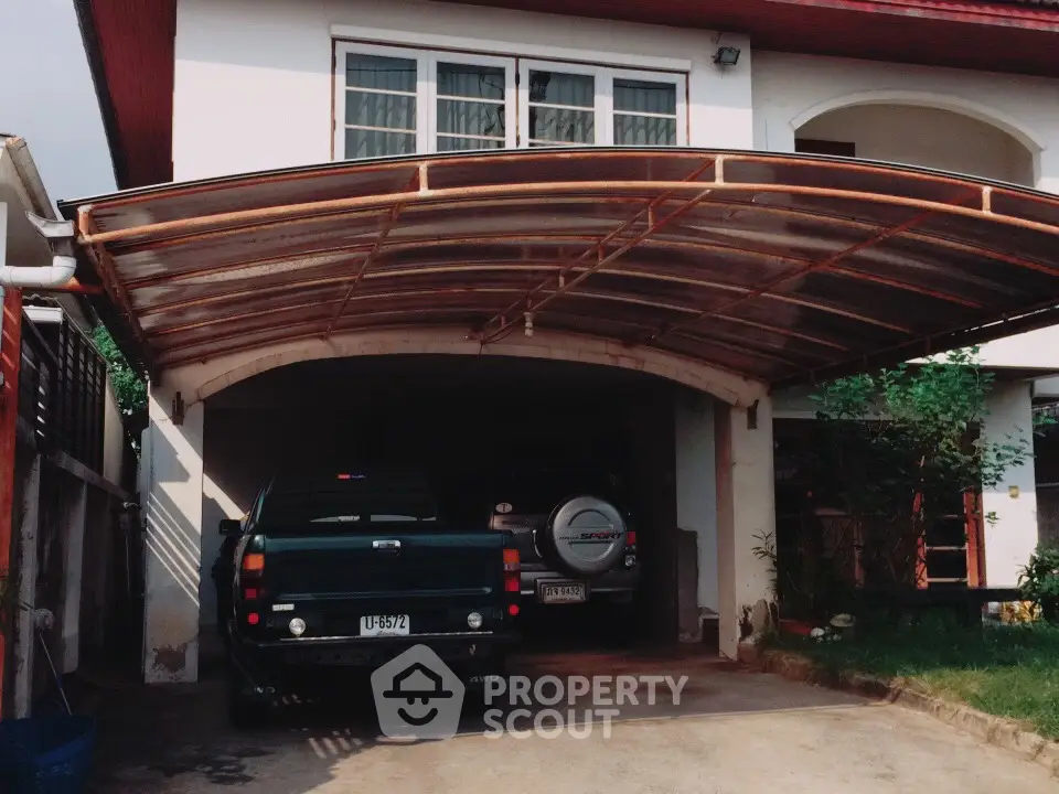 Charming suburban home with covered parking and lush greenery