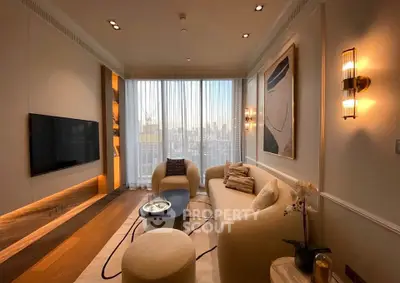 Luxurious modern living room with elegant decor and large window view.