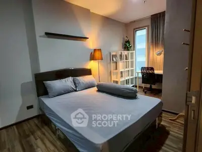 Cozy bedroom with modern decor and study area, perfect for relaxation and productivity.