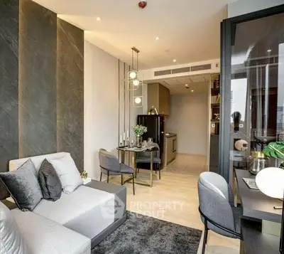 Modern living room with stylish decor and open kitchen layout in luxury apartment.