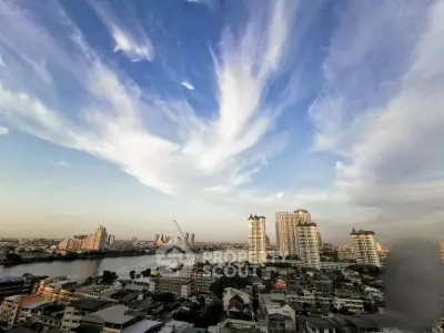 Stunning cityscape view with river and skyscrapers under a dramatic sky, perfect for urban living enthusiasts.