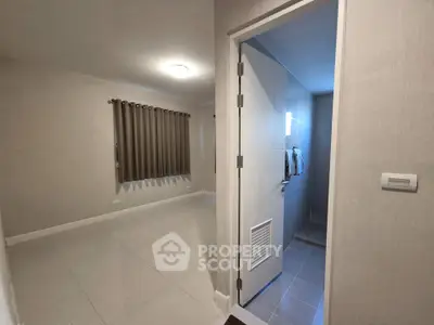 Spacious modern interior with sleek bathroom and large tiled room, perfect for customization.