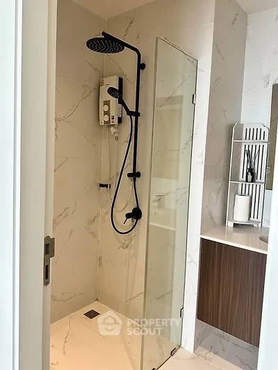 Modern bathroom with sleek shower and elegant marble tiles