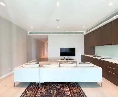 Modern living room with sleek kitchen and stylish decor