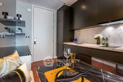 Modern kitchen with sleek cabinetry and marble countertops in luxury apartment