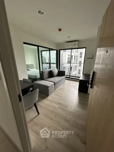 Modern apartment with open living area and balcony view