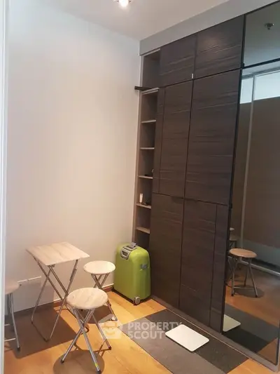Compact study area with foldable furniture and sleek storage solutions.