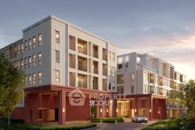 Modern apartment building with elegant facade and lush surroundings at sunset.