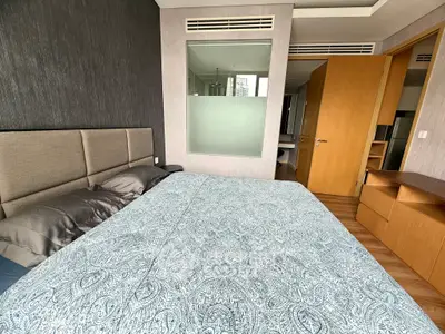 Modern bedroom with stylish decor and large window view