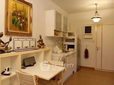 Charming compact kitchen with elegant decor and cozy dining area