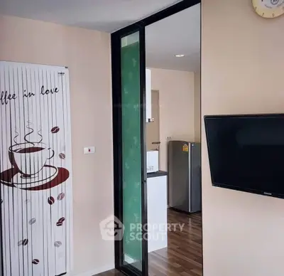 Modern apartment interior with stylish decor and sleek appliances, featuring a cozy living space and contemporary design.