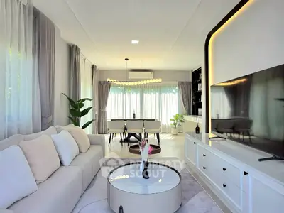 Luxurious modern living room with elegant decor and large windows