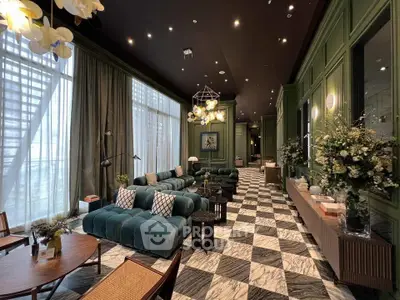 Luxurious living room with elegant decor and plush seating in a modern apartment.