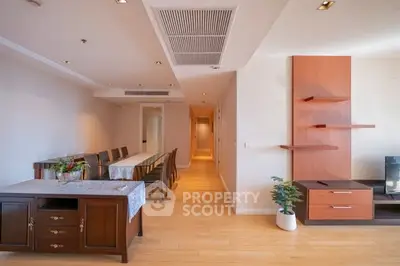 Spacious dining area with elegant wooden furniture and modern decor