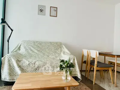 Modern living room with cozy sofa and dining area in minimalist style