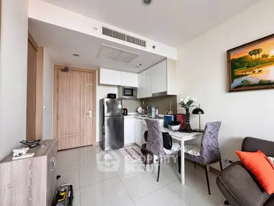 Modern compact kitchen and dining area in a stylish apartment with sleek furniture and contemporary decor.