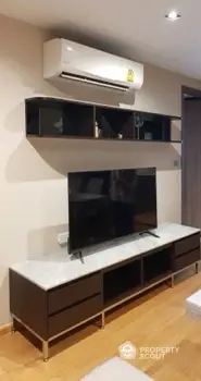 Modern living room with sleek TV unit and air conditioning