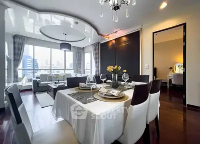Elegant dining room with modern decor and city view, perfect for entertaining guests.