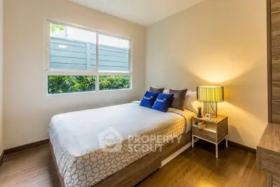 Cozy bedroom with modern decor and natural light