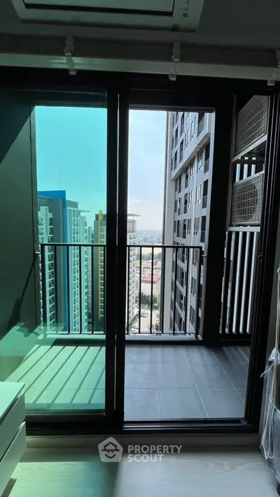 Modern high-rise apartment balcony with stunning city view