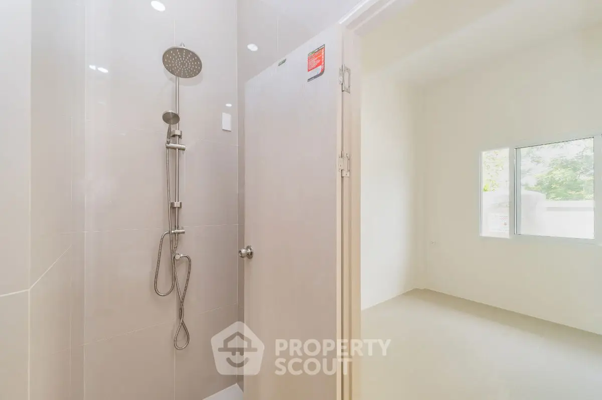 Modern bathroom with sleek shower design and natural light