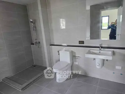 Modern bathroom with sleek fixtures and spacious shower area