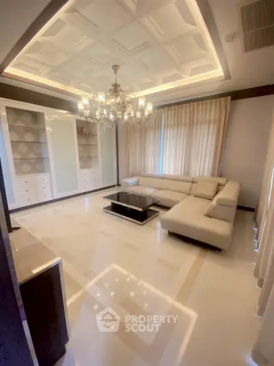 Luxurious living room with elegant chandelier and modern decor