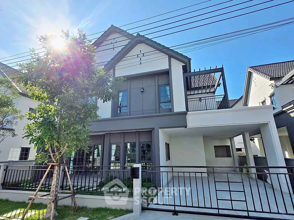 Modern two-story house with sleek design and spacious driveway
