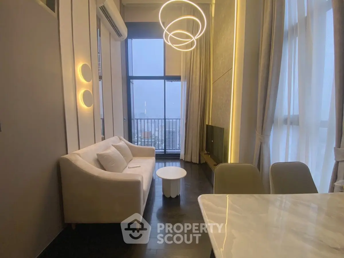 Stylish modern living room with elegant lighting and balcony view