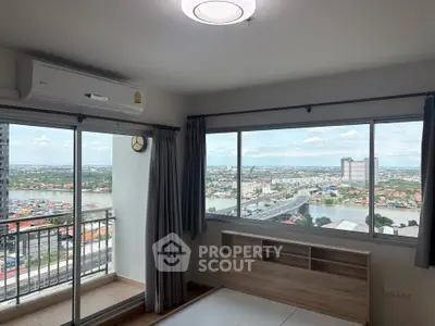 Stunning high-rise apartment with panoramic river view and spacious balcony.