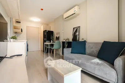 Modern living room with stylish decor and open kitchen layout