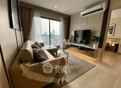 Modern living room with city view, stylish decor, and large TV setup